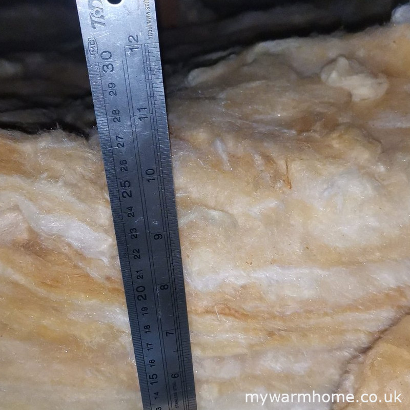 Choose loftinsumeas — Approximately how much loft insulation is being demonstrated in this photograph?